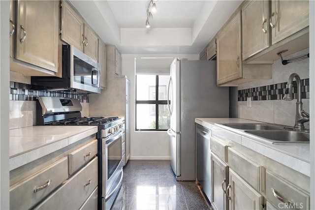 2240 S Palm Canyon Dr Unit 20, Palm Springs, CA 92264 - kitchen with appliances with stainless steel finishes, baseboards, a sink, light countertops, and backsplash