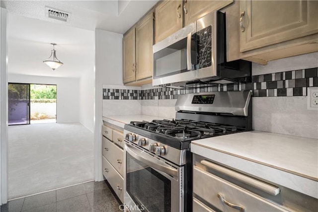 2240 S Palm Canyon Dr Unit 20, Palm Springs, CA 92264 - kitchen featuring stainless steel appliances, light countertops, tasteful backsplash, granite tiled floors, and pendant lighting