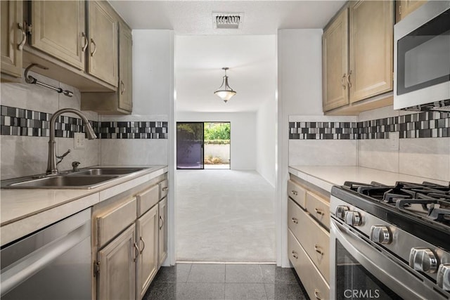 2240 S Palm Canyon Dr Unit 20, Palm Springs, CA 92264 - kitchen featuring stainless steel appliances, a sink, light countertops, and backsplash