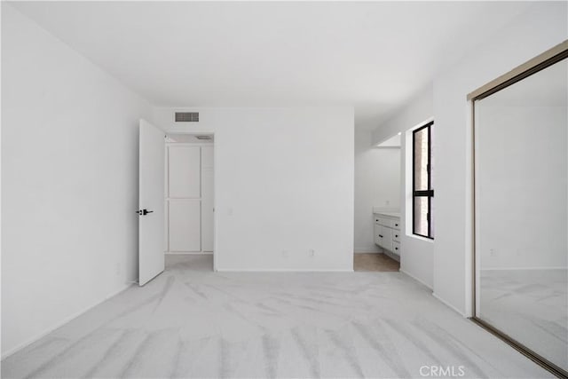 2240 S Palm Canyon Dr Unit 20, Palm Springs, CA 92264 - unfurnished bedroom featuring light colored carpet and baseboards
