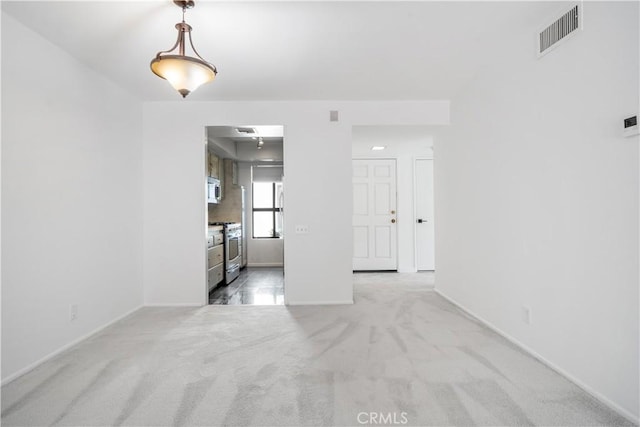 2240 S Palm Canyon Dr Unit 20, Palm Springs, CA 92264 - unfurnished living room with light colored carpet and baseboards
