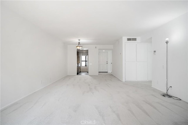 2240 S Palm Canyon Dr Unit 20, Palm Springs, CA 92264 - unfurnished living room featuring light colored carpet