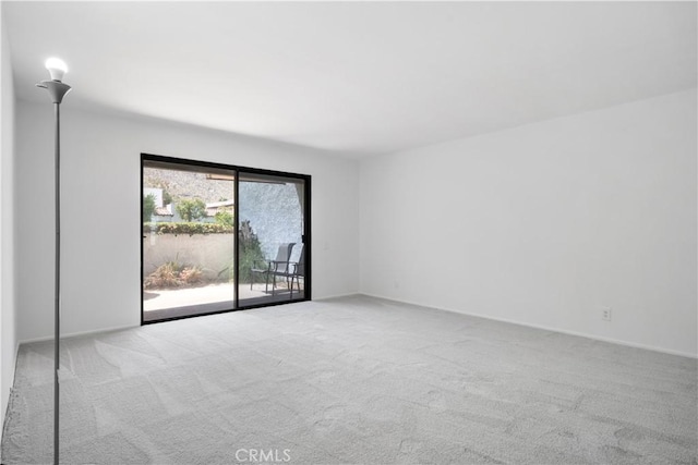 2240 S Palm Canyon Dr Unit 20, Palm Springs, CA 92264 - empty room featuring carpet and baseboards