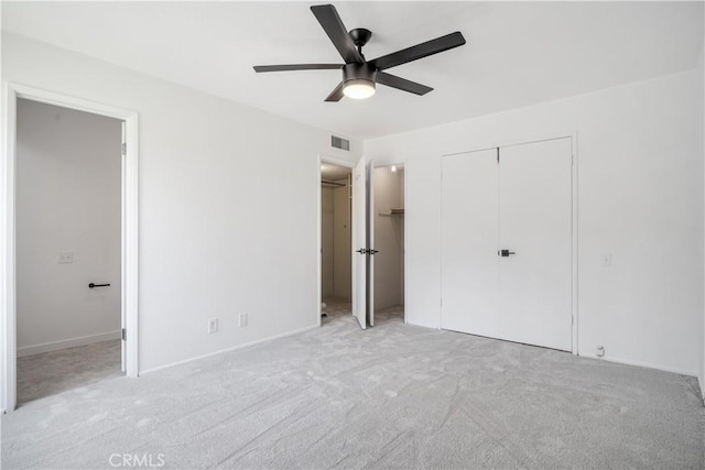 2240 S Palm Canyon Dr Unit 20, Palm Springs, CA 92264 - unfurnished bedroom with light carpet, ceiling fan, and ensuite bathroom