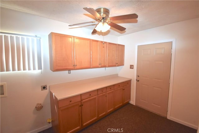 laundry area with baseboards, hookup for a washing machine, ceiling fan, electric dryer hookup, and cabinet space