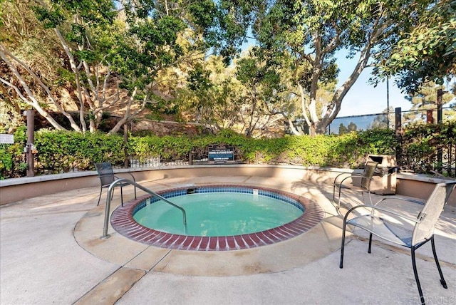 view of pool with a community hot tub