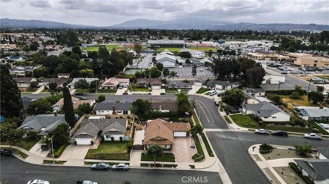 birds eye view of property featuring a residential view and a mountain view
