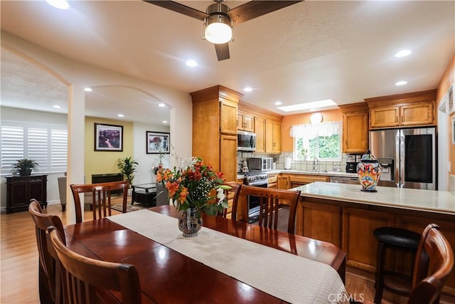 dining room featuring recessed lighting, a ceiling fan, and light wood-style floors