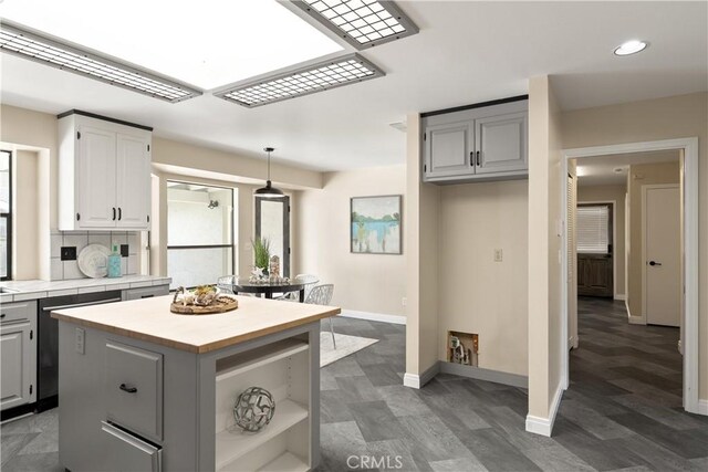 1635 Almendia Dr, Chico, CA 95926 - kitchen featuring baseboards, recessed lighting, tile countertops, a center island, and gray cabinets