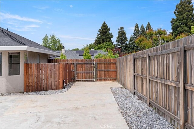 1635 Almendia Dr, Chico, CA 95926 - fenced backyard with a patio area and a gate