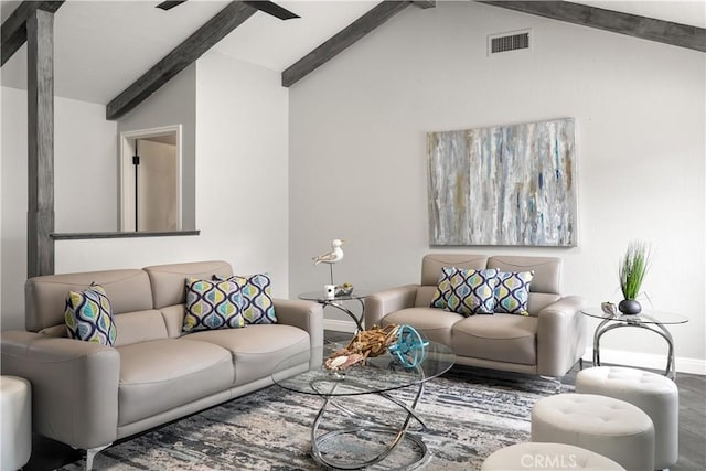 living area with baseboards, visible vents, vaulted ceiling with beams, and wood finished floors