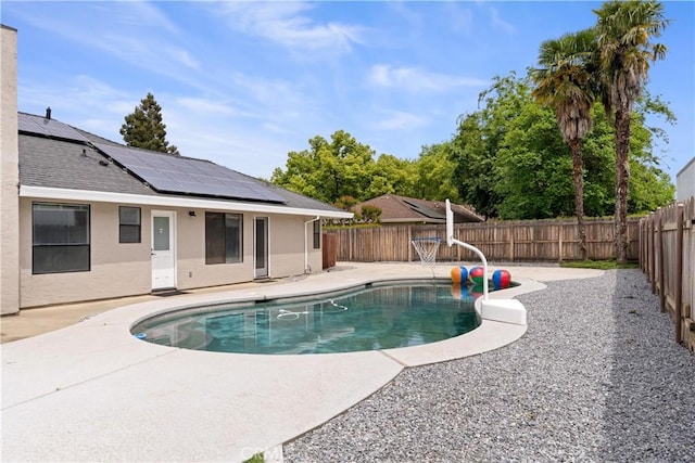 view of swimming pool featuring a patio, a fenced in pool, and a fenced backyard