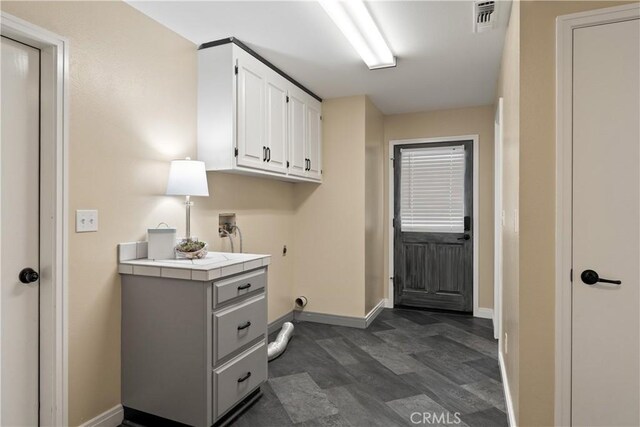 1635 Almendia Dr, Chico, CA 95926 - washroom with washer hookup, baseboards, hookup for an electric dryer, and cabinet space