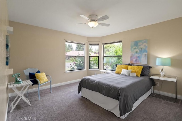 bedroom with carpet floors, baseboards, and a ceiling fan