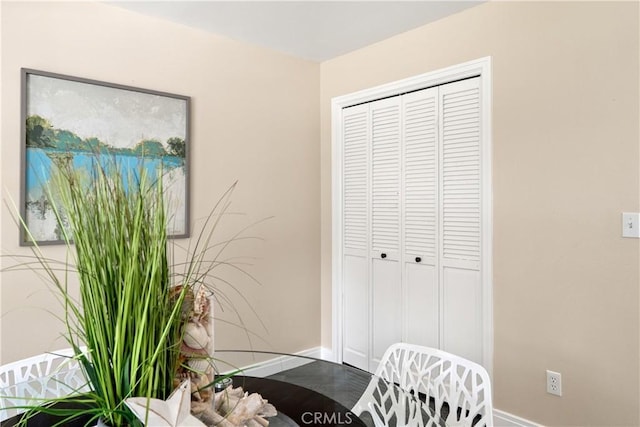 interior space featuring baseboards
