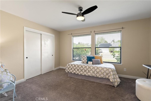 carpeted bedroom with a ceiling fan, baseboards, and a closet
