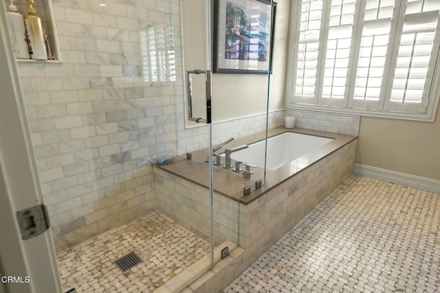 5580 Bromely Dr, Oak Park, CA 91377 - bathroom featuring a stall shower, baseboards, and a bath