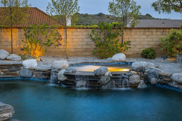 5580 Bromely Dr, Oak Park, CA 91377 - exterior space featuring a garden pond and fence