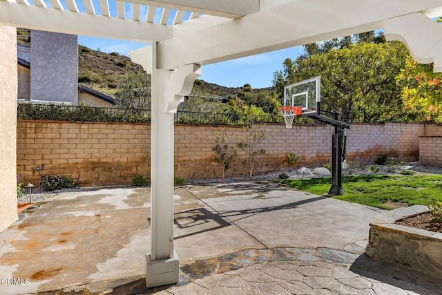 5580 Bromely Dr, Oak Park, CA 91377 - view of patio featuring fence and basketball court