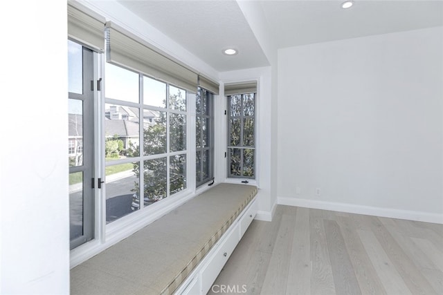 interior space with light wood-style floors, recessed lighting, and baseboards