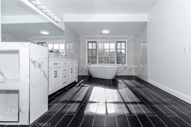 full bathroom featuring vanity and a soaking tub
