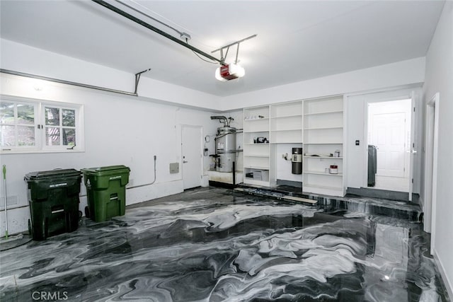 garage featuring secured water heater and a garage door opener