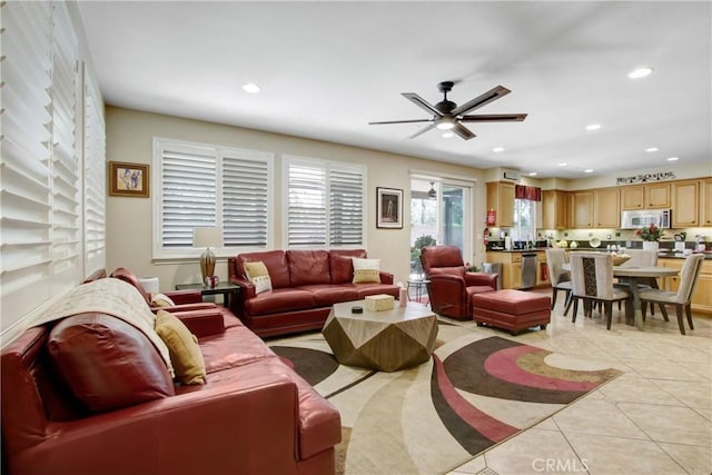 living area featuring recessed lighting, a ceiling fan, and light tile patterned floors