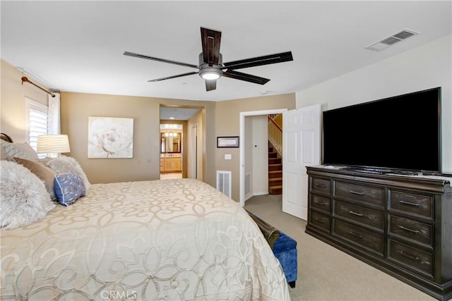 carpeted bedroom with ceiling fan and visible vents
