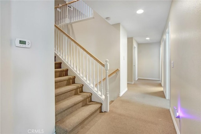staircase with carpet flooring, recessed lighting, and baseboards