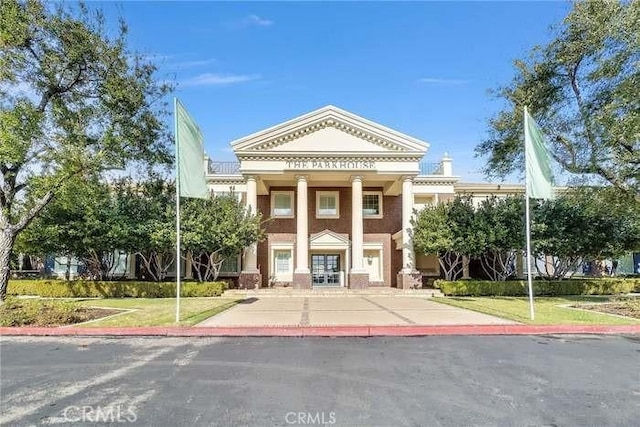 view of front of home with french doors and a front yard