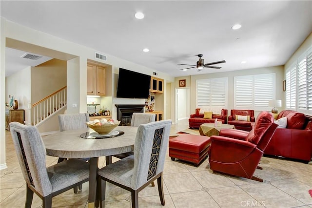 dining area featuring visible vents, a ceiling fan, stairs, and recessed lighting