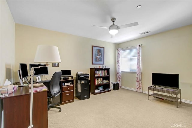 office with light colored carpet, ceiling fan, visible vents, and baseboards