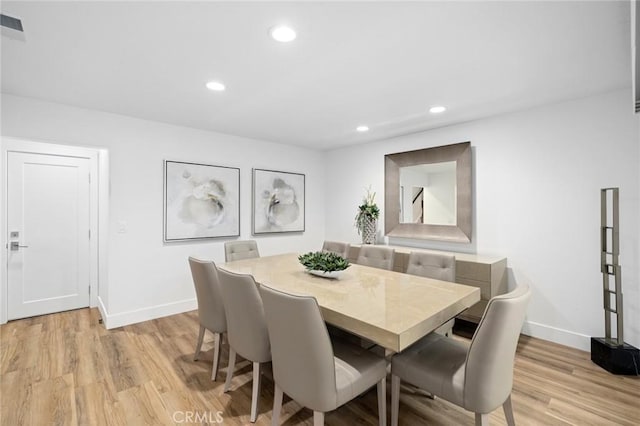 dining area featuring baseboards, recessed lighting, and light wood-style flooring