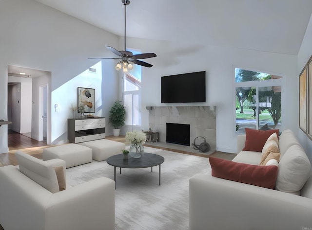 15408 Glentree Rd, Valley Center, CA 92082 - living room with high vaulted ceiling, wood finished floors, a ceiling fan, and a tiled fireplace