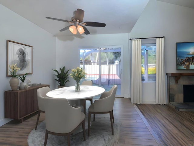 15408 Glentree Rd, Valley Center, CA 92082 - dining space featuring lofted ceiling, a ceiling fan, wood finished floors, and a fireplace with raised hearth