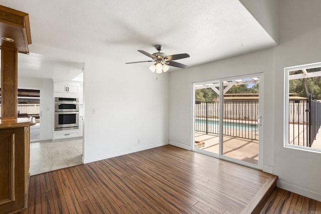 15408 Glentree Rd, Valley Center, CA 92082 - unfurnished living room featuring wood finished floors and ceiling fan