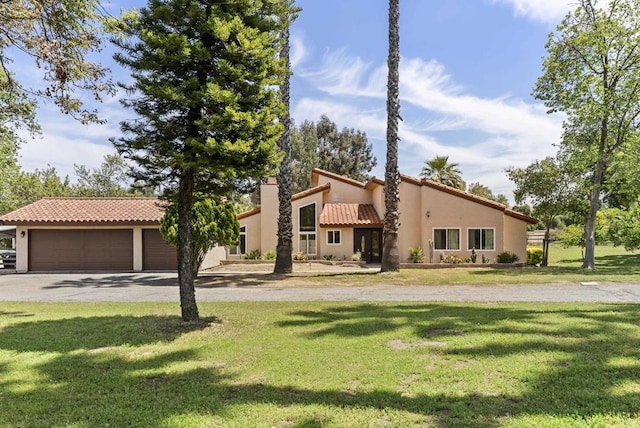 15408 Glentree Rd, Valley Center, CA 92082 - view of front of house with stucco siding, a tile roof, a front yard, and driveway