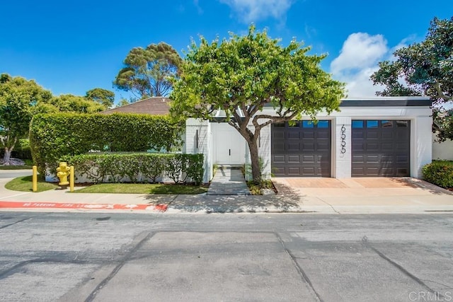view of front of home featuring a garage and driveway