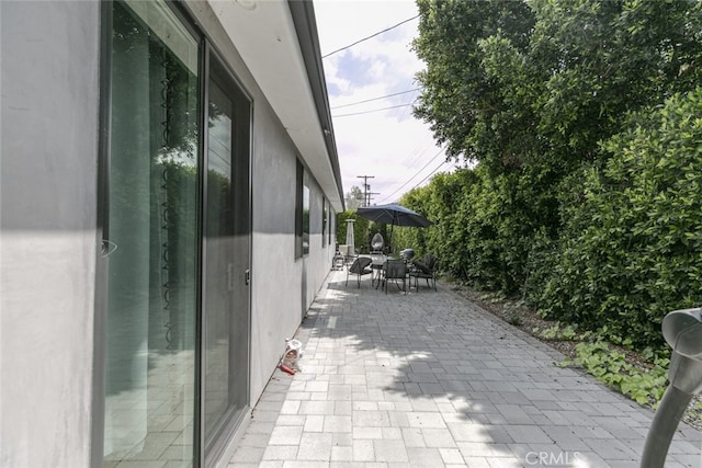 view of patio featuring outdoor dining area