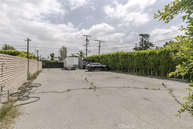 uncovered parking lot with fence