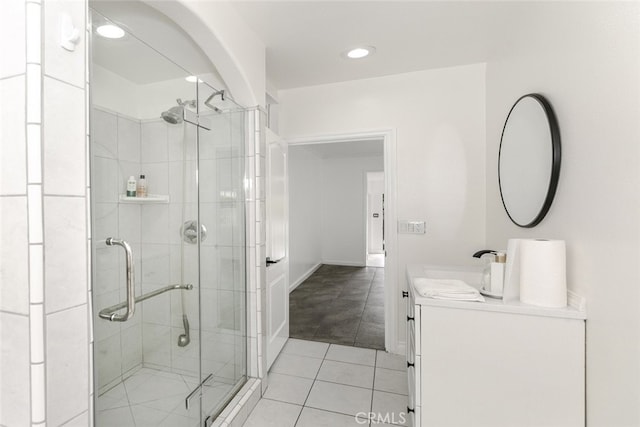 full bathroom with vanity, tile patterned floors, a stall shower, and recessed lighting
