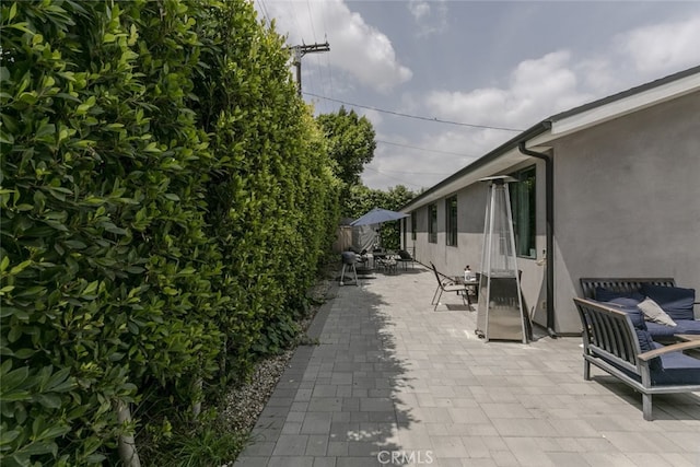 view of patio / terrace featuring fence and outdoor dining space