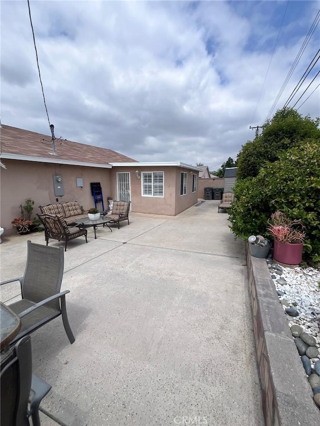 19522 Caney Ave, Carson, CA 90746 - exterior space with outdoor lounge area, a patio area, and stucco siding