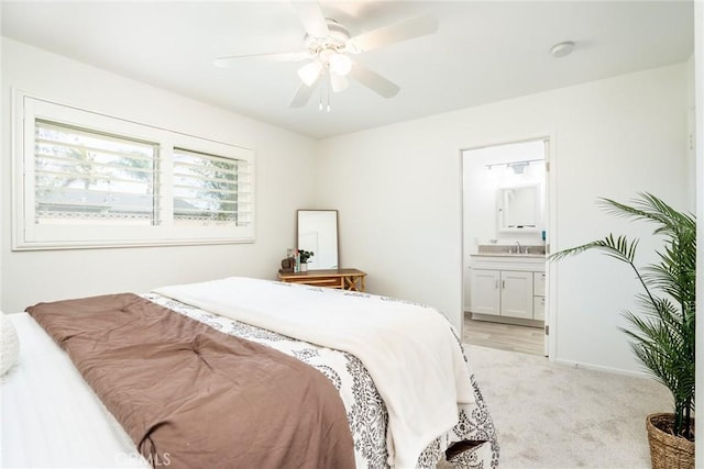 bedroom featuring light colored carpet, connected bathroom, and ceiling fan