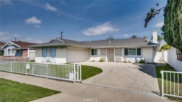 single story home with an attached garage, driveway, a fenced front yard, and stucco siding