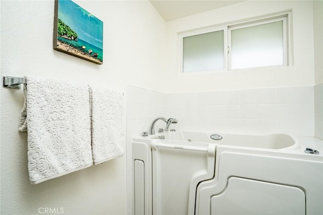 full bath with a bath