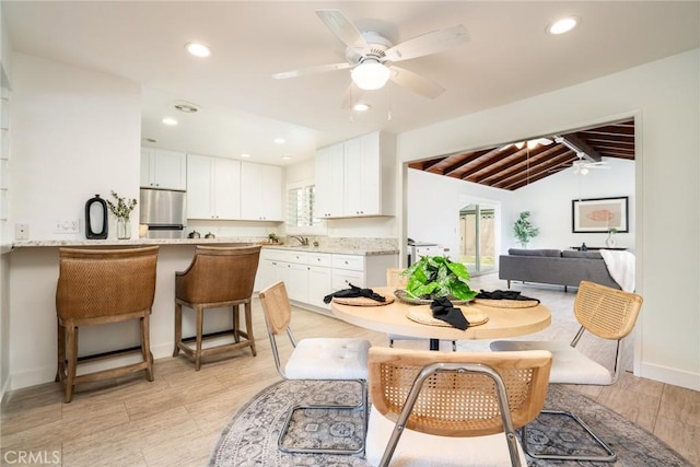 dining area featuring baseboards, ceiling fan, lofted ceiling with beams, and recessed lighting
