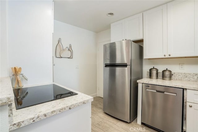 11862 Amethyst, Garden Grove, CA 92845 - kitchen featuring stainless steel appliances, white cabinetry, light stone countertops, and recessed lighting