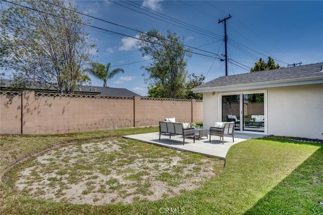 view of yard with fence, an outdoor living space, and a patio area