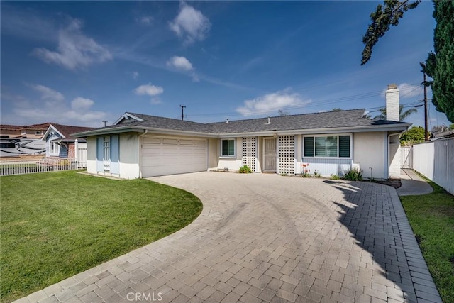 ranch-style home with an attached garage, stucco siding, driveway, and a front yard